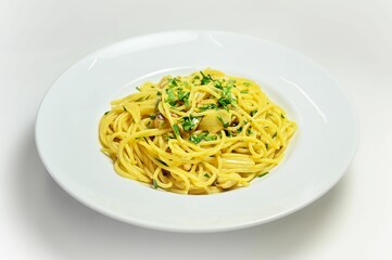 Gourmet plate of spaghetti with herbs isolated on a white background