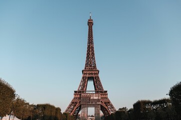 Closeup of the Eifel tower under the blue sky in Paris, France