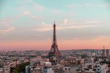 Obraz premium Drone shot of the Eifel tower and surrounding buildings in Paris, France
