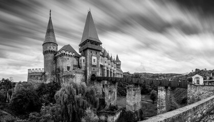 Grayscale shot of the Corvin Castle. Hunedoara, Romania