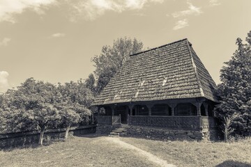 Beautiful shot of the Ilie Lazar's humble wooden house in the village of Giulesti, Maramures