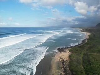 Aerial view of a beautiful seascape with white foamy waves in 
Hawaii