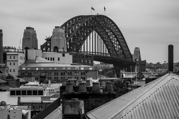 Iconic view of the Harbor Bridge in Sydney, Australia in striking black and white shot