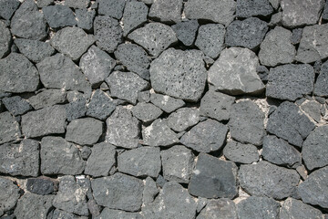 Wall made of bricks of volcanic rocks at Lanzarote, Canary Islands