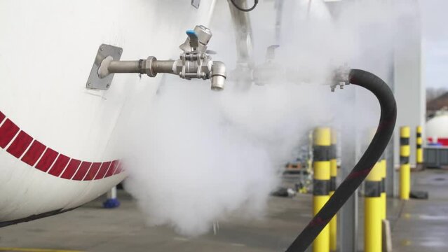 Massive amount of steam leaving gas tanker, close up view