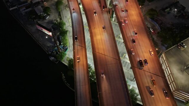 Establishing aerial top down view of Miami i95 Riverside city traffic at night. Downtown Miami Skyline, I 95 Highway in 4k aerial view. Main Interstate Highway of Florida Atlantic Coast