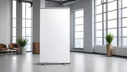 A white roll up banner stands prominently in an empty room, creating a focal point in the minimalistic space