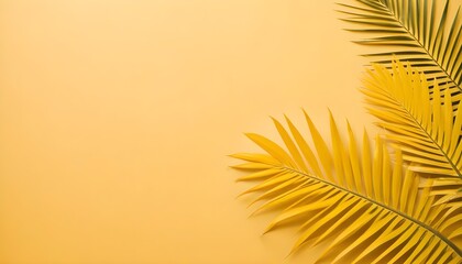 Palm leaves displayed on a vibrant yellow backdrop, creating a striking contrast and adding a tropical touch