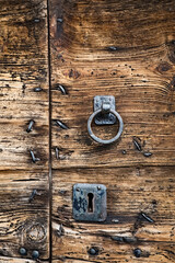 Old wooden door with locks of a Cimbrian building in the Cimbrian village of Zamberlini. Bosco...