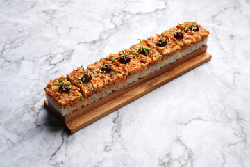 Japanese oshizushi sushi with eel on a marble table background