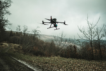 Aerial view of a drone moderning over forest, monitoring and analyzing in forestry management. Dron mapping forest after natural disaster assessing damage.