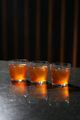 Alcoholic shots on bar counter. Glasses with alcoholic beverage