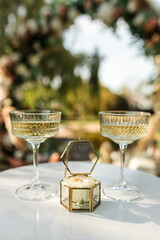 box with wedding rings and champagne glasses, wedding decor
