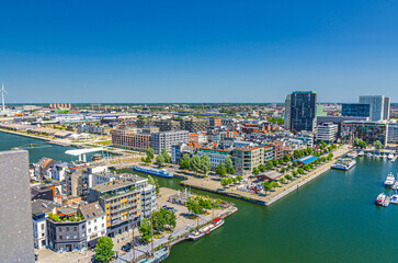 Antwerp cityscape, aerial panoramic view of Antwerp city Eilandje quarter neighborhood with port area, water canals, Bonaparte Dock, skyline horizon panorama of Antwerpen, Flemish Region, Belgium