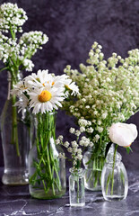 Fresh white gypsophila, piones on a white background. Wedding date. An invitation to a holiday. Congratulation.An empty space for text. View from above.