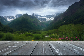 Beautiful summer valley with empty wooden table. Natural template landscape