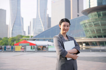 Confident Businesswoman Outdoors in a Modern City