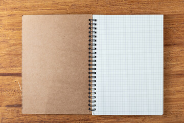 note book on wooden background