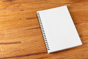 note book on wooden background