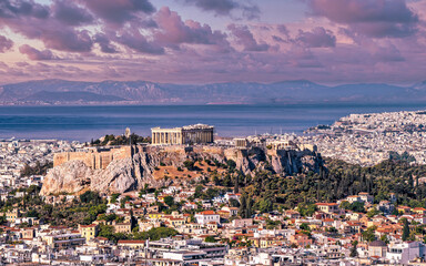 Panoramic view of Athens with Parthenon on the Acropolis and the Saronic sea in the background...