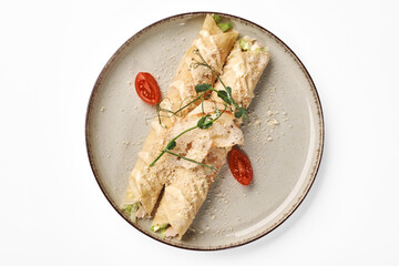 Gourmet stuffed crepe rolls with Caesar dressing and parmesan