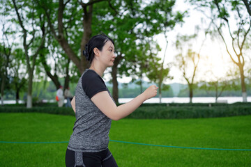 Young Woman Enjoying a Sunset Run in the Park