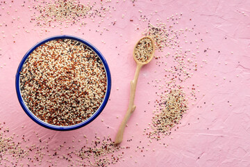 Quinoa mix. Mixed white, red and black quinoa seeds in a bowl, with a wooden spoon, top shot with...