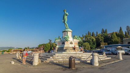 Fototapeta premium Bronze copy of the statue of David by Michelangelo at Piazzale Michelangelo timelapse hyperlapse in Florence