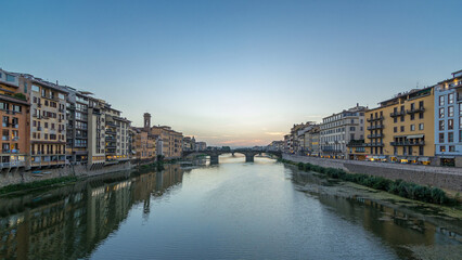 Ponte Santa Trinita Holy Trinity Bridge day to night timelapse over River Arno in Florence