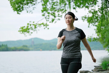 Fitness Enthusiast Enjoying a Lakeside Jog