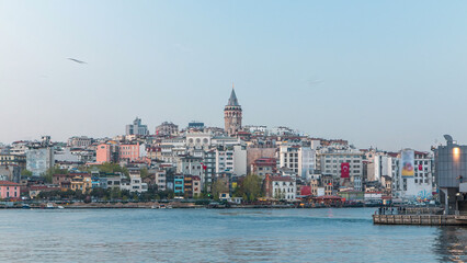 Fototapeta premium View over golden horn bay on the galata tower and its neighborhood day to night timelapse in Istanbul.