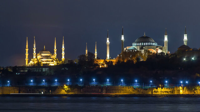 Hagia Sophia and Blue Mosque timelapse at night reflected in Bosphorus water. Istanbul, Turkey