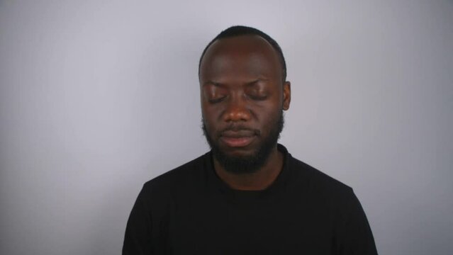 Black Male Listening To Music With White Background