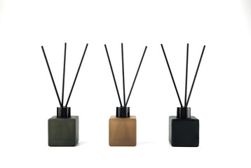 luxury aroma scent reed diffuser glass bottles are on the white background they are earth tone...