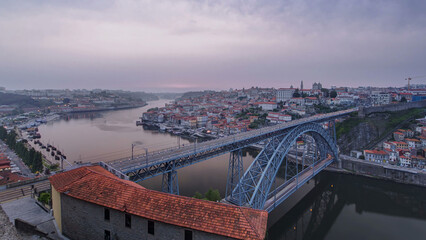 Day to Night view of the historic city of Porto, Portugal timelapse with the Dom Luiz bridge