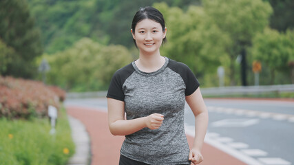 Active Woman Jogging on a Beautiful Outdoor Trail