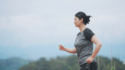Healthy Lifestyle - Woman Jogging in Nature
