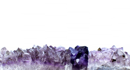 eautiful druses of natural purple mineral amethyst on a white background. Healing chakra crystals. Copy space.
