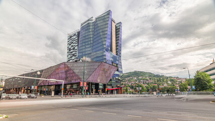 Skyscrapers and shopping mall with large luminous screen in Sarajevo City Center timelapse...