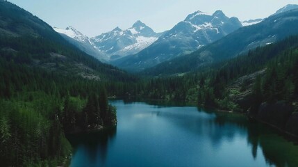 Serene Mountain Lake Surrounded by Lush Forests and Snow-Capped Peaks