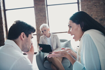 Photo of young couple conflict appointment psychotherapist loft interior office indoors