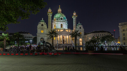 Karlskirche on the Karlsplatz square night timelapse hyperlapse in Vienna, Austria.