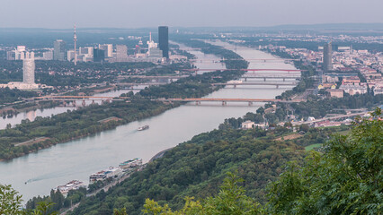 Fototapeta premium Skyline of Vienna from Danube Viewpoint Leopoldsberg aerial day to night timelapse.
