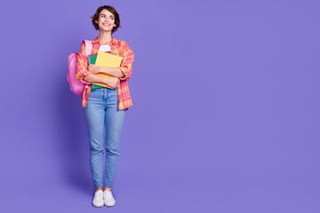 Full size photo of nice young girl look empty space wear shirt isolated on violet color background