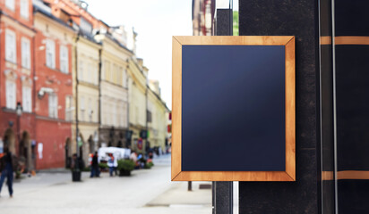 Business mockup banner sign on wall on main city street with copy negative space