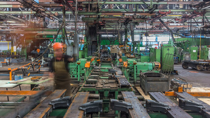 Conveyor assembly stage the body of tractor at big industrial factory timelapse