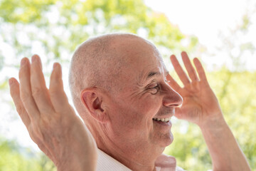 happy Joyful senior man with twinkle in eye, embracing life's simple pleasures, sprightly retiree...