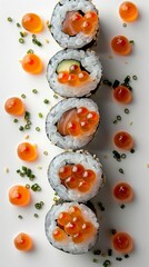 A close-up image of a variety of sushi rolls, including salmon roe, cucumber, and avocado