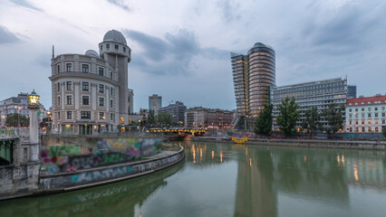 Obraz premium Urania and Danube Canal day to night timelapse in Vienna.