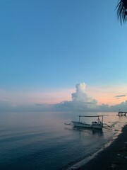 morning sun in Bali, Indonesia. Traditional fishing boats at Sanur Beach, Bali, Indonesia.